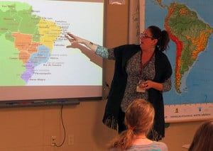 Teacher teaching to classroom of students